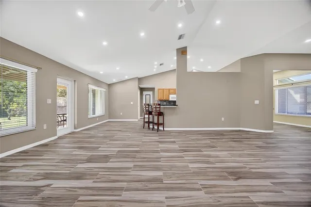 a view of a kitchen with a flat screen tv and a window