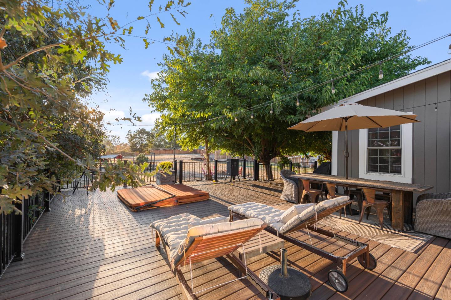 9735 New Avenue Gilroy, CA 95020 - Photo 36 of 52 a view of a patio with chairs and table on wooden floor