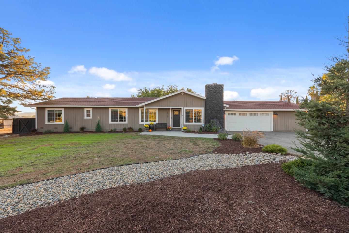 9735 New Avenue Gilroy, CA 95020 - Photo 37 of 52 a front view of a house with a garden and yard