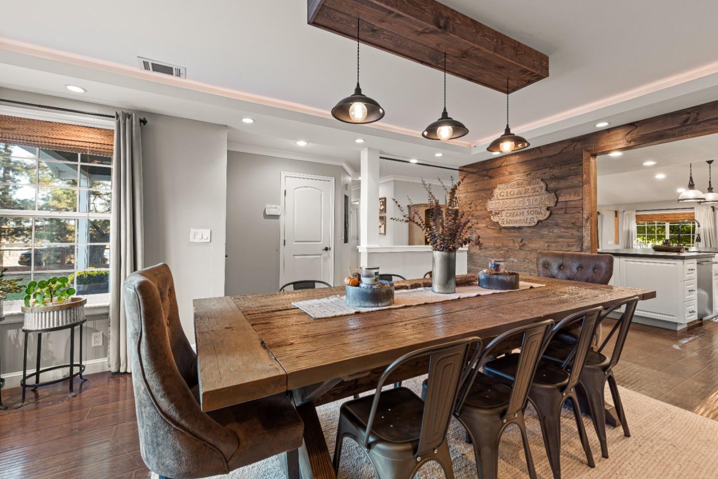 9735 New Avenue Gilroy, CA 95020 - Photo 7 of 52 a view of a dining room with furniture window and wooden floor