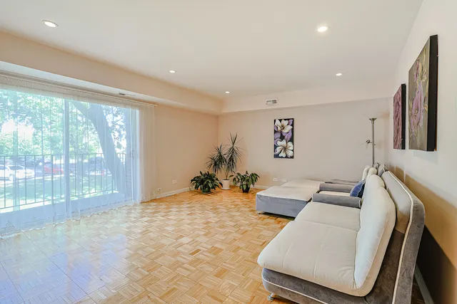 a view of a balcony with wooden floor