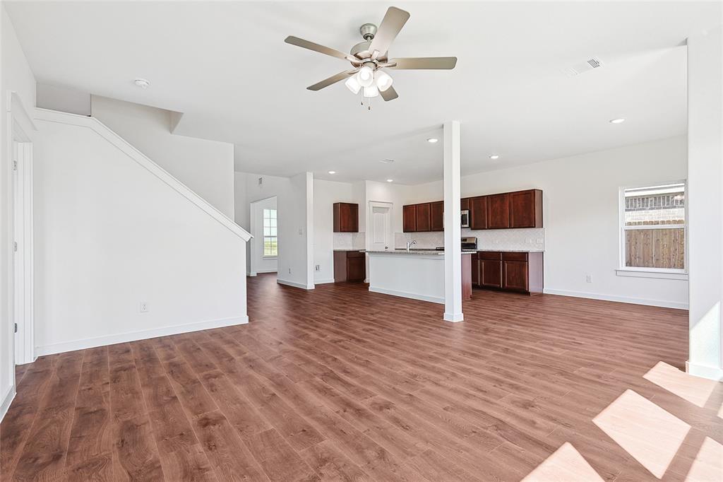 213 Patton Lane Venus, TX 76084 - Photo 13 of 30 Unfurnished living room featuring a ceiling fan, dark wood finished floors, and recessed lighting