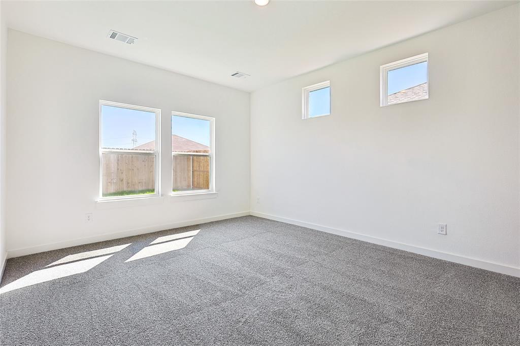 213 Patton Lane Venus, TX 76084 - Photo 15 of 30 Empty room featuring plenty of natural light and carpet