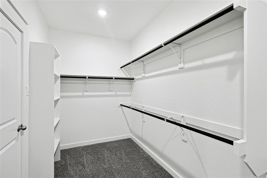 213 Patton Lane Venus, TX 76084 - Photo 21 of 30 Walk in closet featuring dark colored carpet