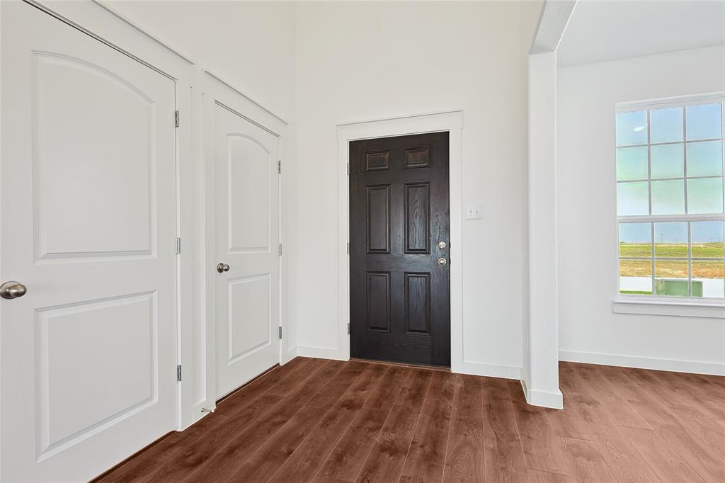 213 Patton Lane Venus, TX 76084 - Photo 3 of 30 Foyer entrance featuring dark wood-style flooring and baseboards