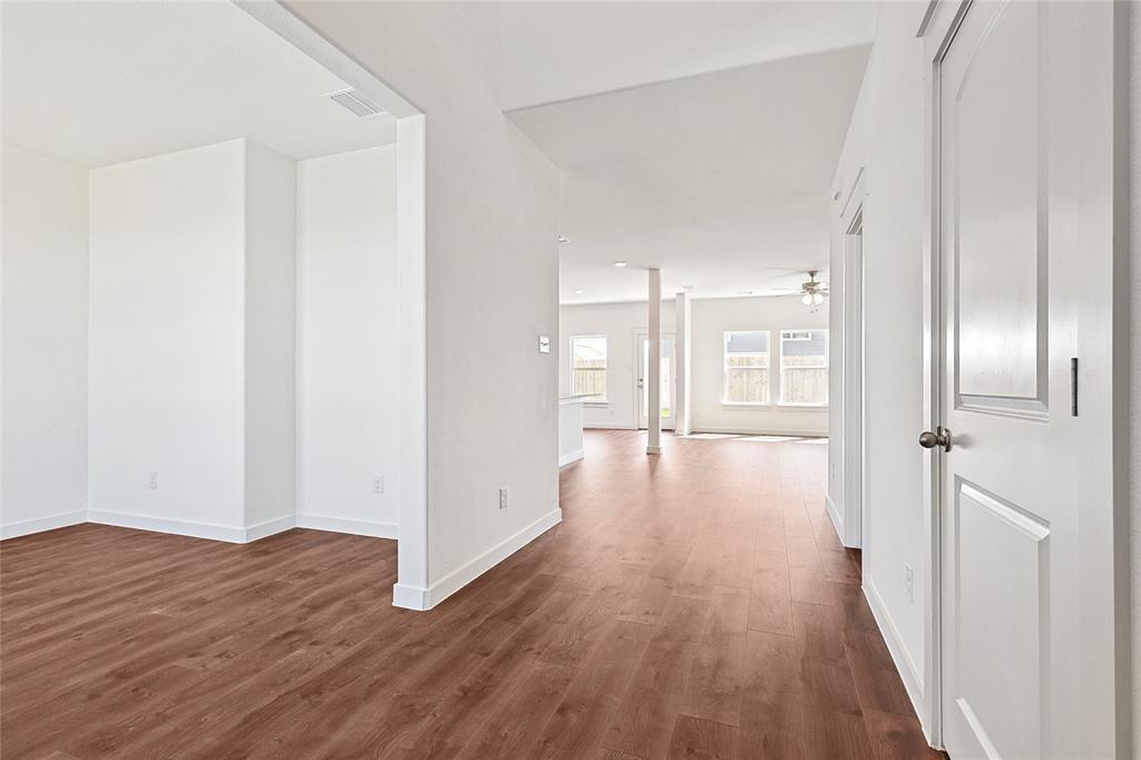 213 Patton Lane Venus, TX 76084 - Photo 4 of 30 Hallway featuring dark wood-style floors and baseboards