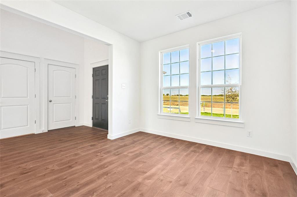 213 Patton Lane Venus, TX 76084 - Photo 6 of 30 Unfurnished bedroom featuring dark wood-style floors and baseboards