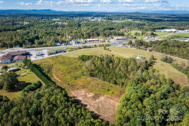 a view of a swimming pool with a yard