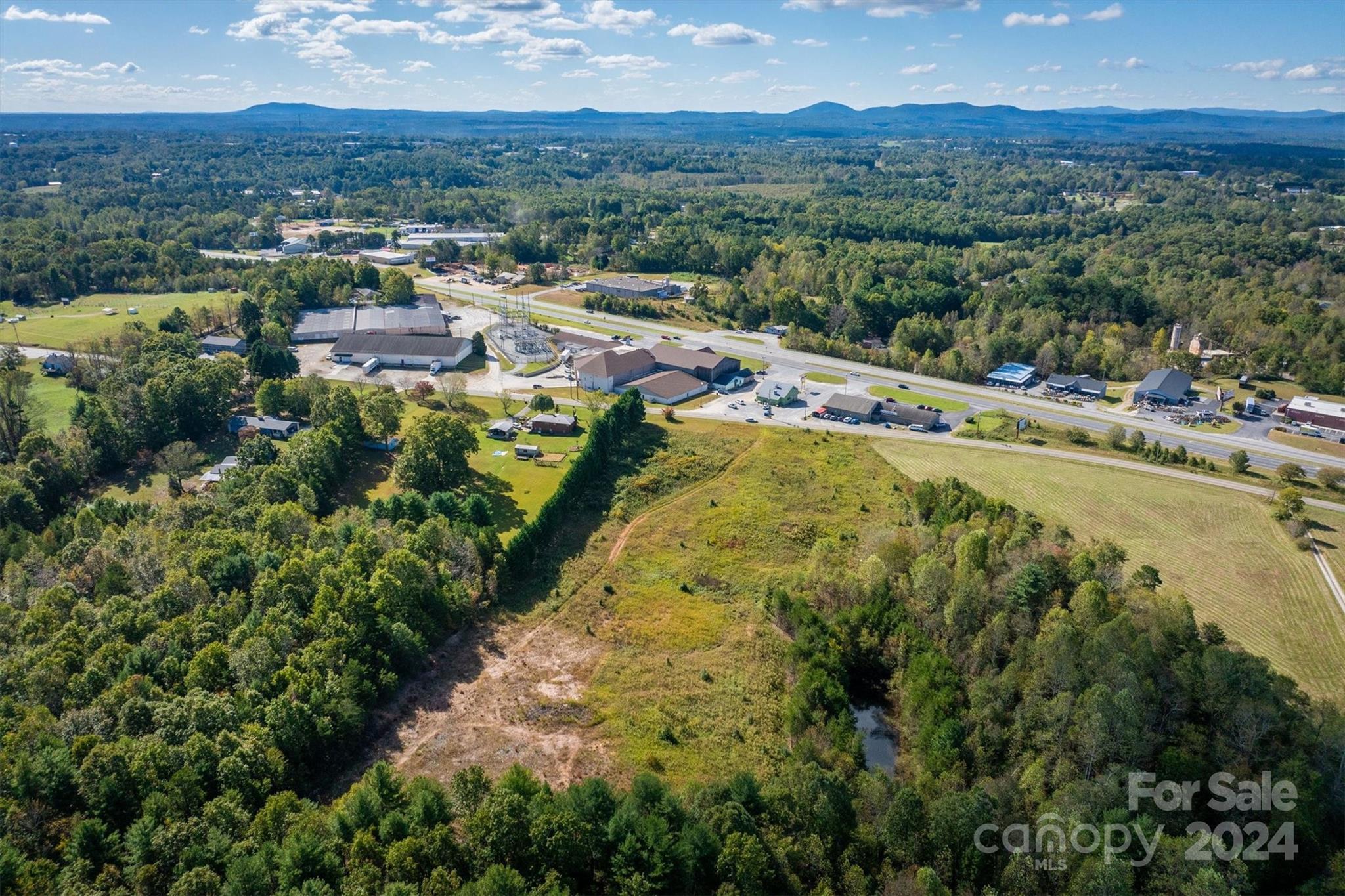 4054 Lower Cedar Valley Road Hudson, NC 28638 - Photo 8 of 15 a view of a city with mountains in the background