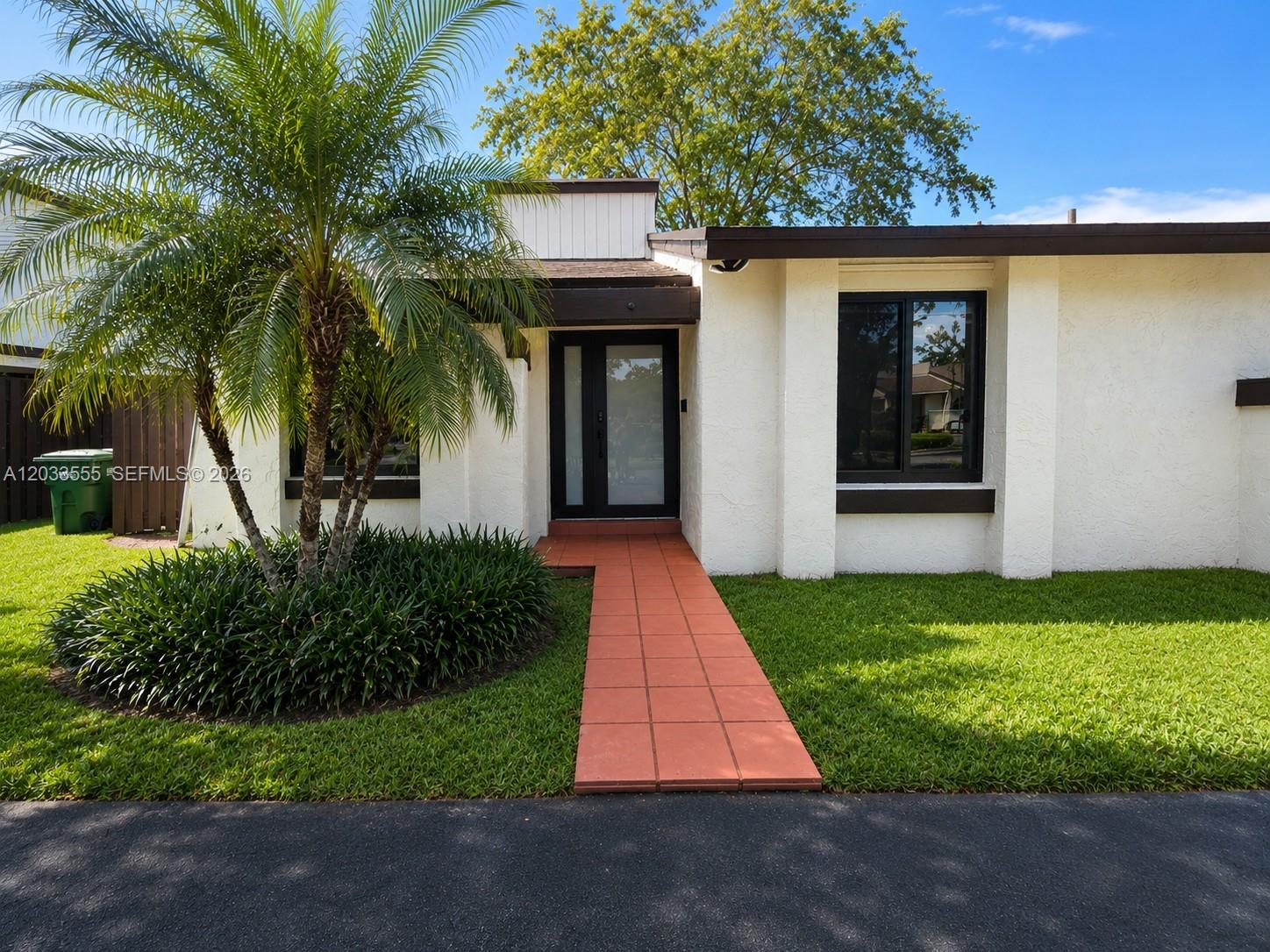 12737 Southwest 68th Terrace Miami, FL 33183 - Photo 1 of 32 Front exterior of the home featuring the main entryway and designated parking space.