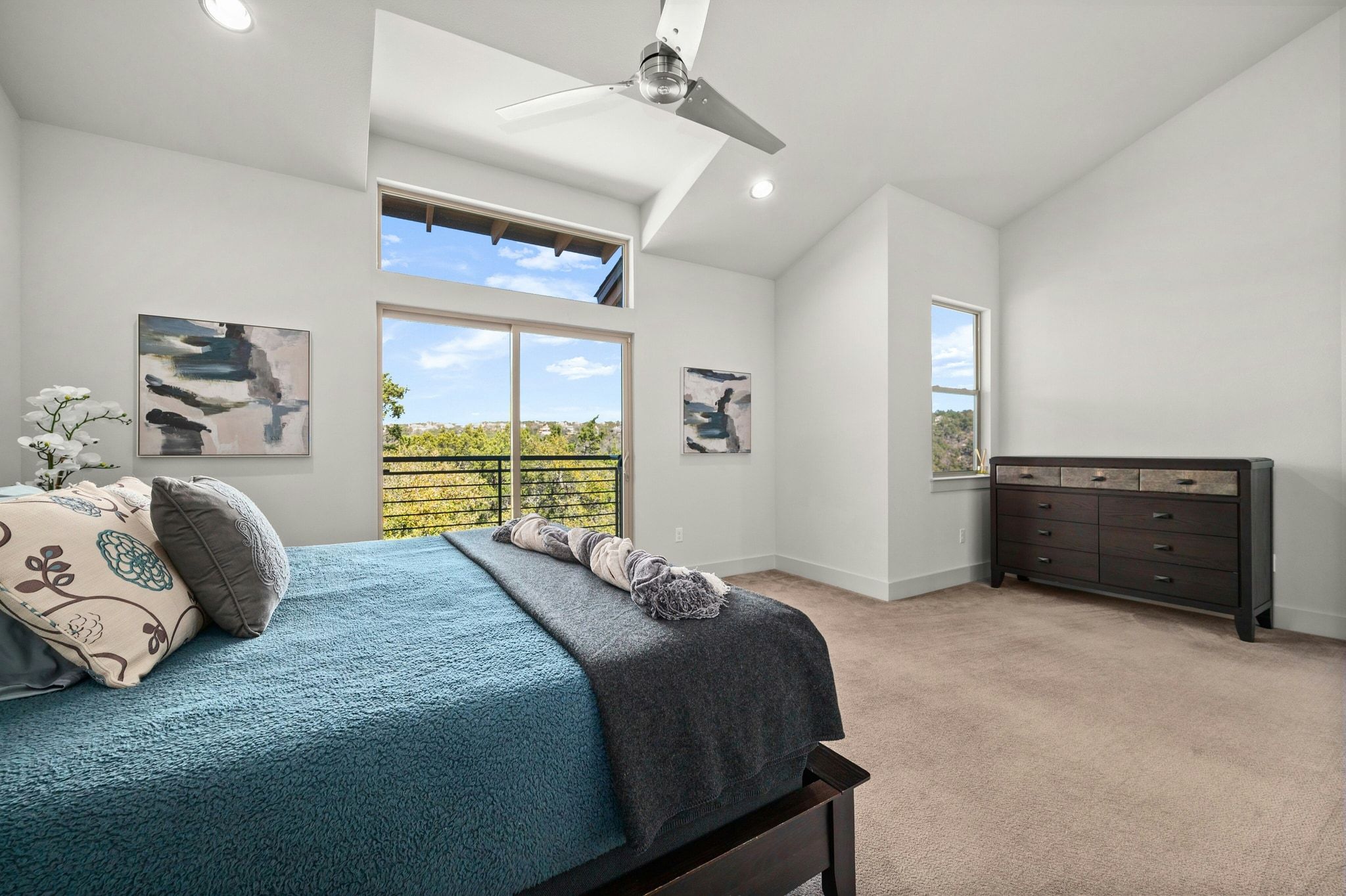 8110 Ranch Road 2222, Unit 92 Austin, TX 78730 - Photo 16 of 40 Vaulted ceiling with an architectural window and ceiling fan