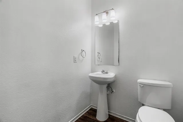 a bathroom with a sink and mirror