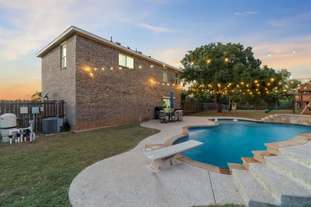 a view of swimming pool with chairs