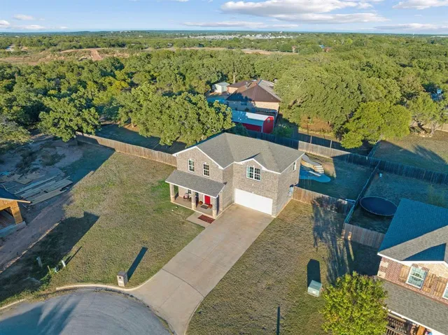 an aerial view of a house with a ocean view