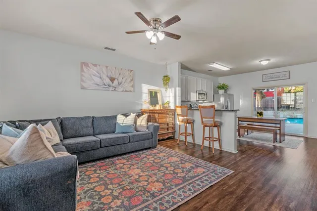 a living room with furniture and a rug