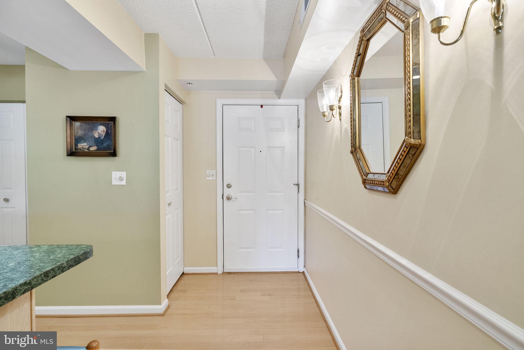 223 Brandon Road Eagleville, PA 19403 - Photo 10 of 38 a view of a hallway with paintings on the wall
