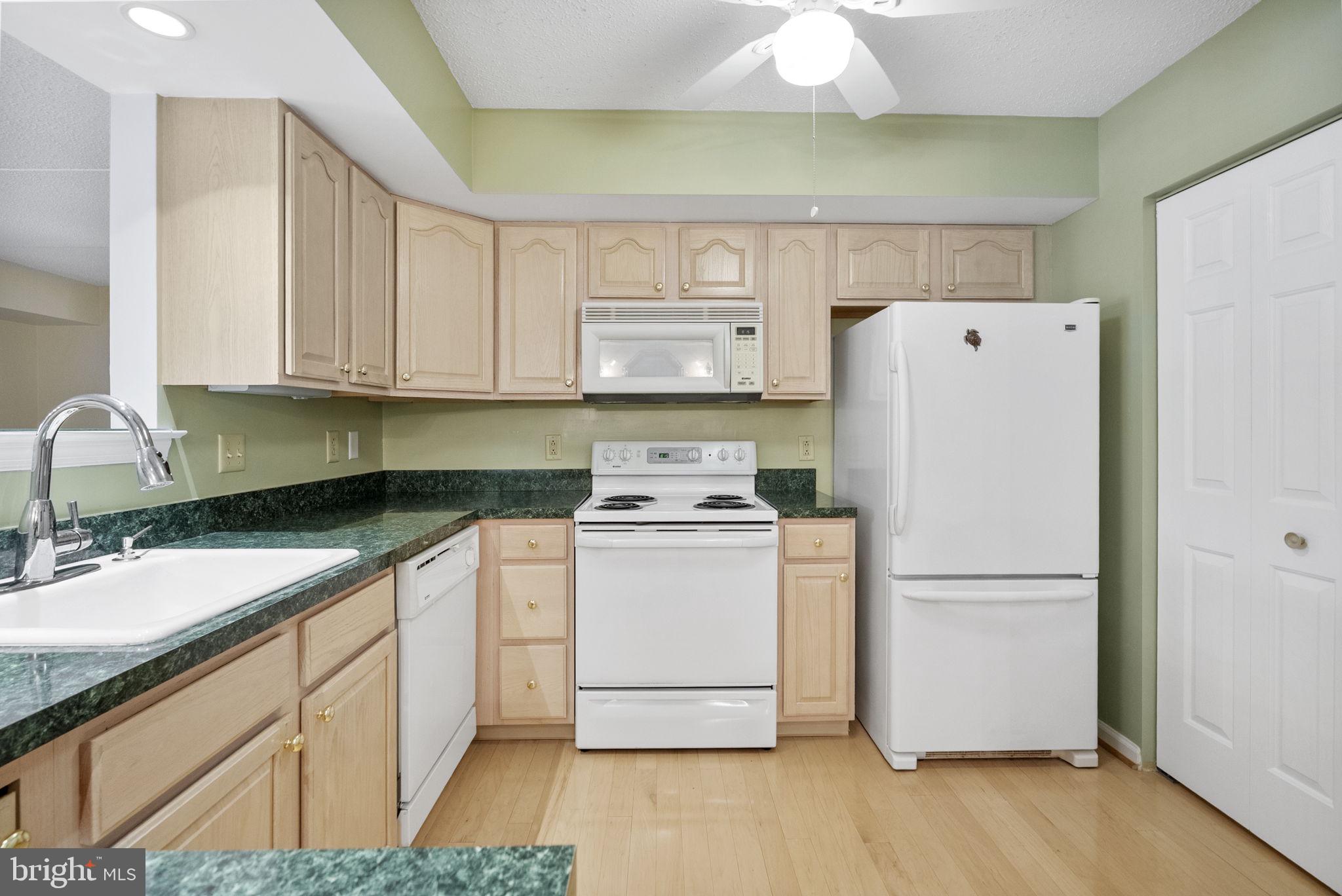223 Brandon Road Eagleville, PA 19403 - Photo 12 of 38 a kitchen with a refrigerator and a sink
