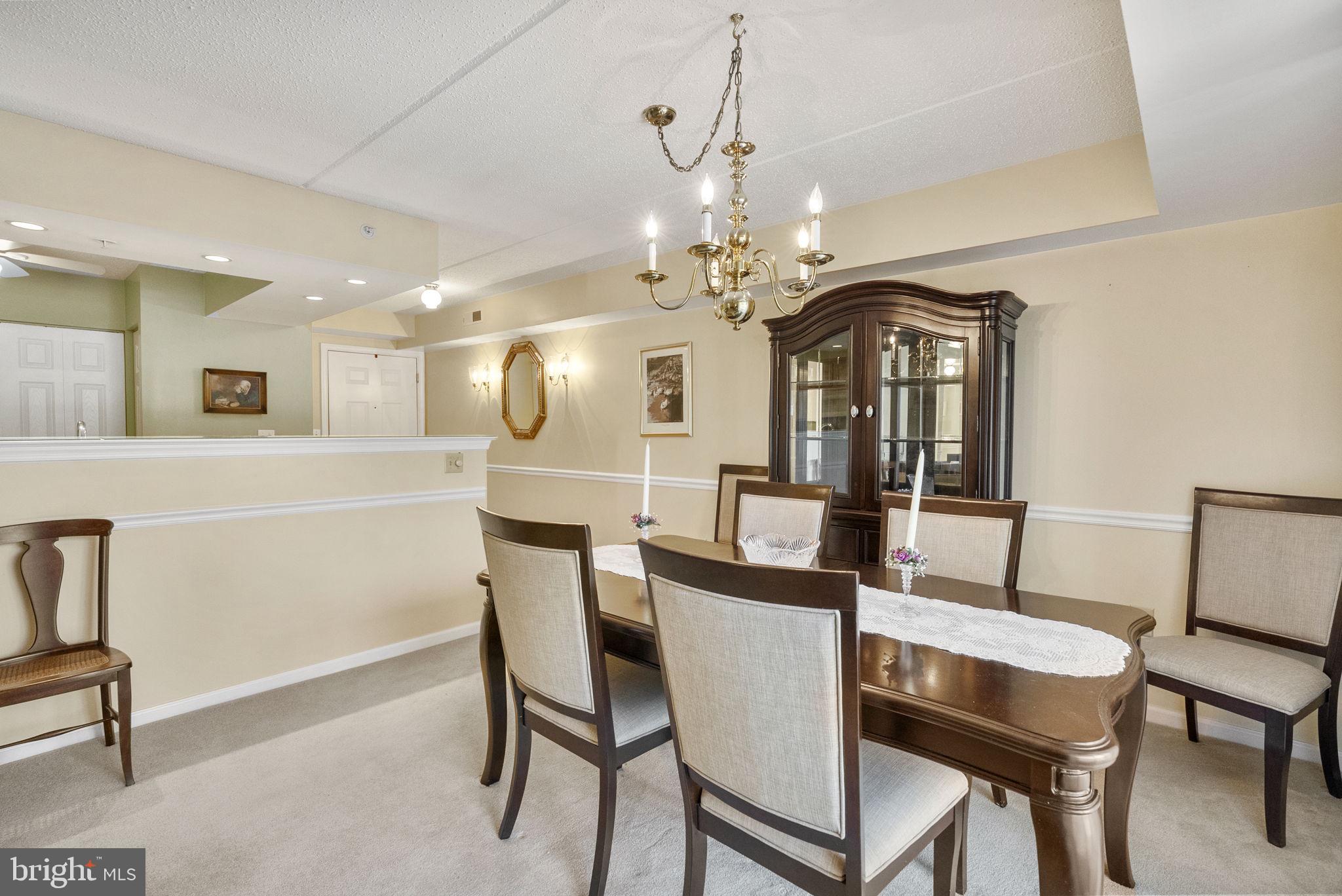 223 Brandon Road Eagleville, PA 19403 - Photo 18 of 38 a view of a dining room with furniture and a chandelier