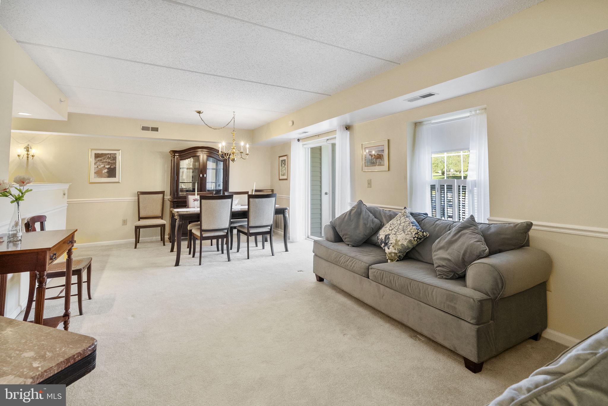 223 Brandon Road Eagleville, PA 19403 - Photo 19 of 38 a living room with furniture and kitchen view