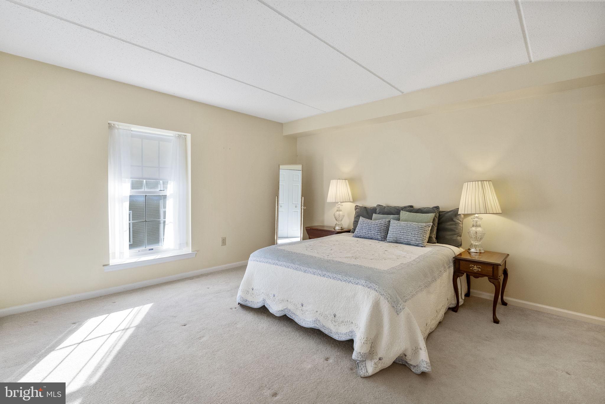 223 Brandon Road Eagleville, PA 19403 - Photo 20 of 38 a spacious bedroom with a bed and a window