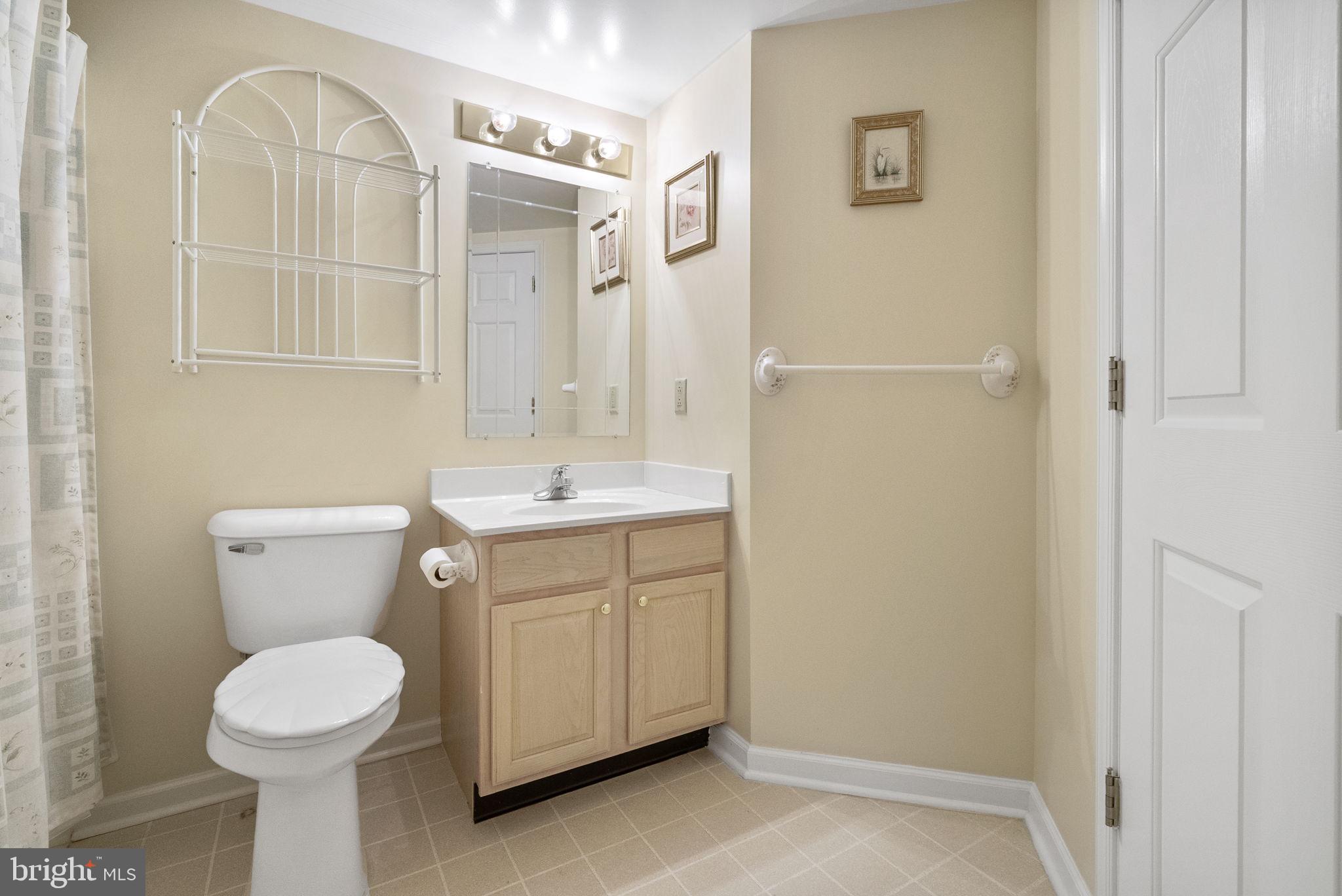 223 Brandon Road Eagleville, PA 19403 - Photo 25 of 38 a bathroom with a sink and a mirror