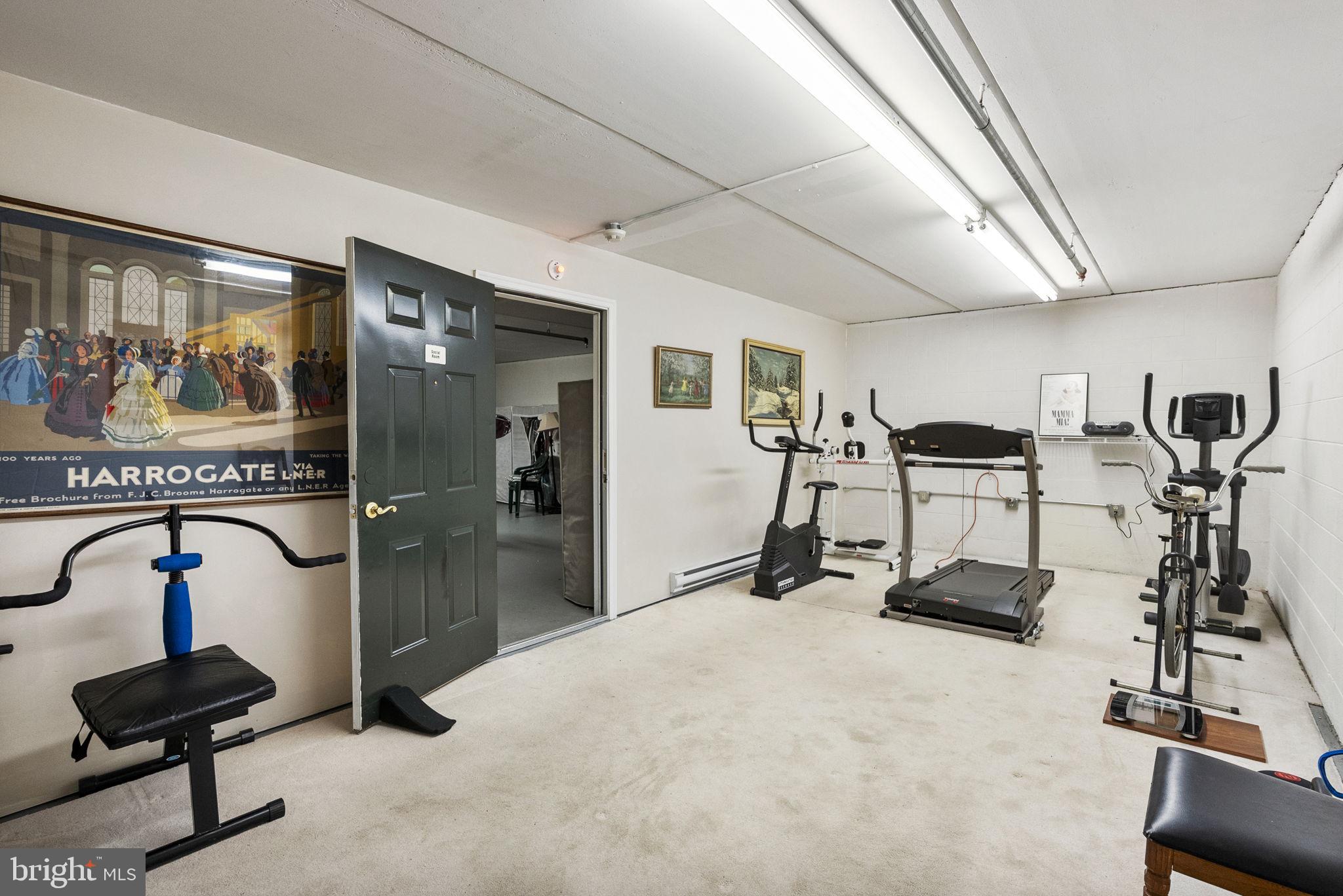 223 Brandon Road Eagleville, PA 19403 - Photo 31 of 38 a room with gym equipment and large mirror