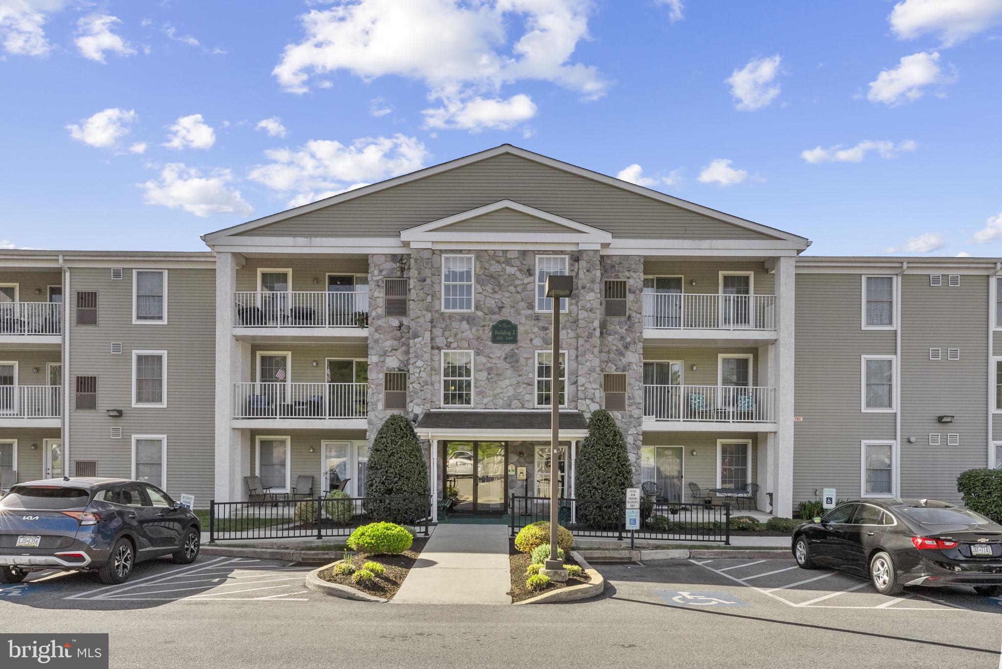 223 Brandon Road Eagleville, PA 19403 - Photo 4 of 38 a front view of a building with parking