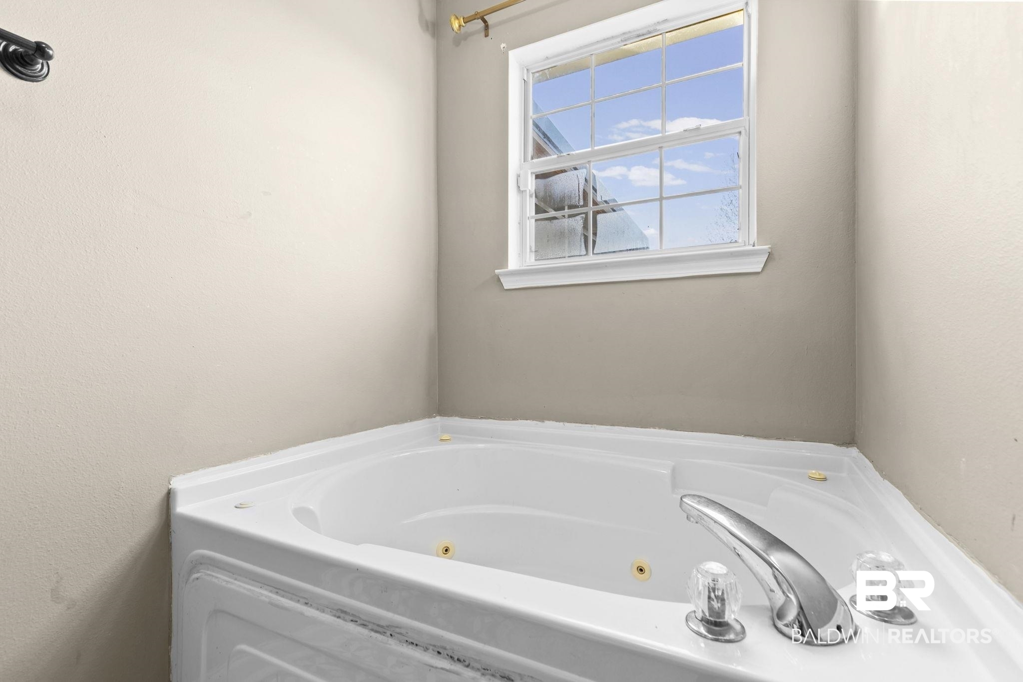 3842 Experiment Farm Road Monroeville, AL 36460 - Photo 38 of 59 Bathroom featuring a jetted tub and a textured wall