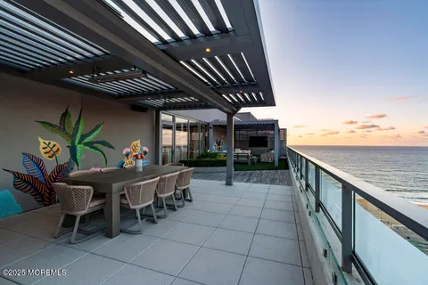 a swimming pool view with a seating space