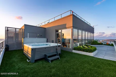 a view of a garden with lawn chairs