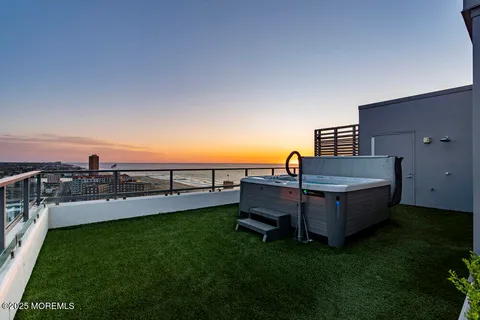 a view of staircase with lots of trees and plants