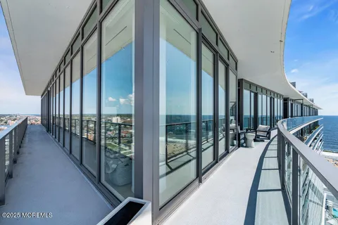 a large kitchen with a large window and stainless steel appliances