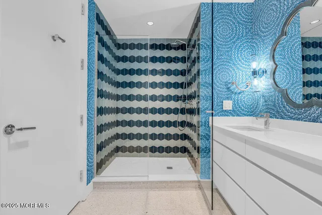 a living room with furniture a rug and white walls