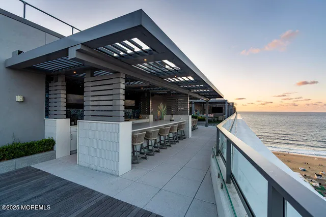 a living room with furniture a flat screen tv and a table