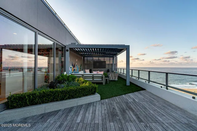 a view of a patio with table and chairs with a barbeque grill