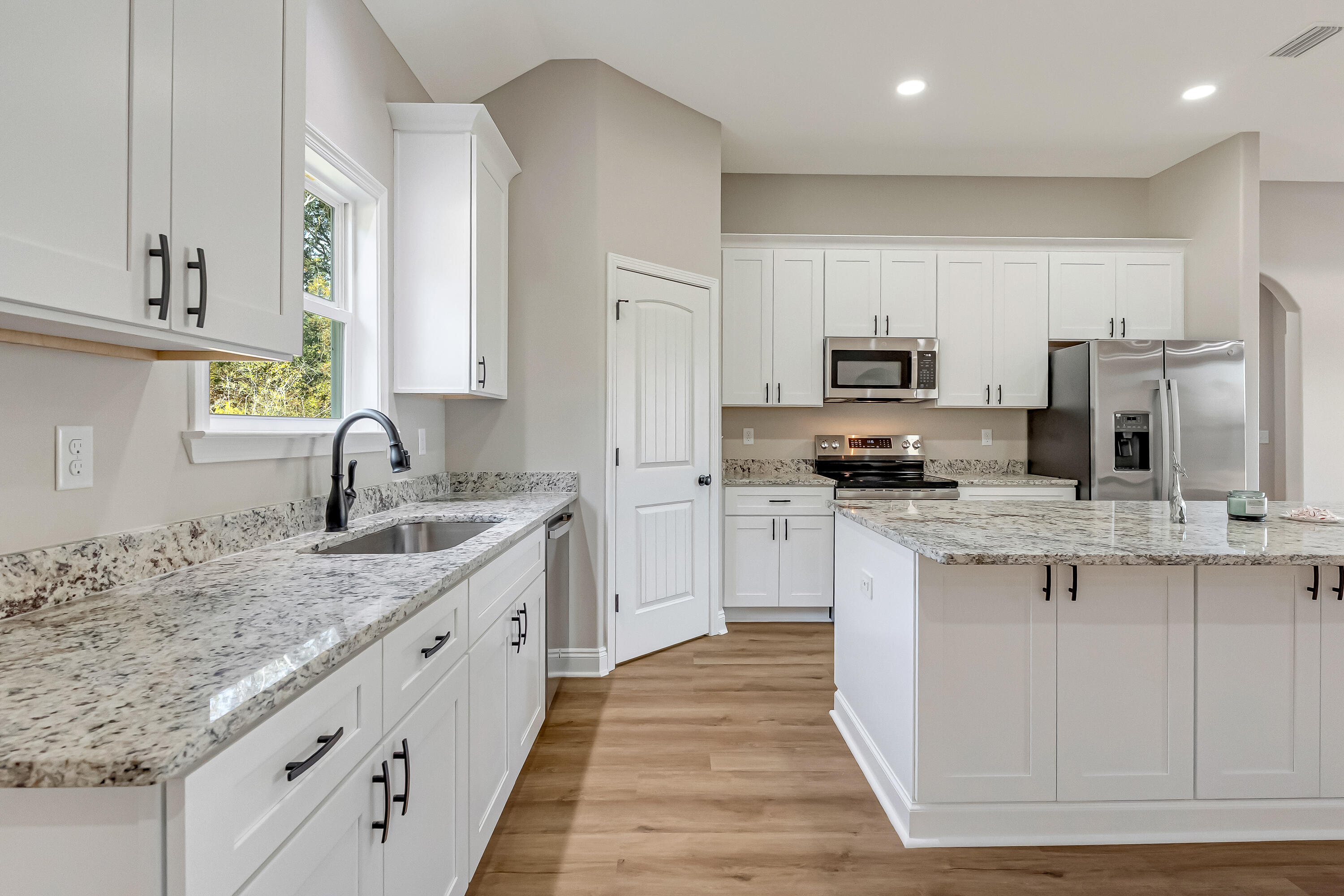 5840 Phillip Road Crestview, FL 32539 - Photo 24 of 59 a kitchen with stainless steel appliances granite countertop a sink stove and refrigerator