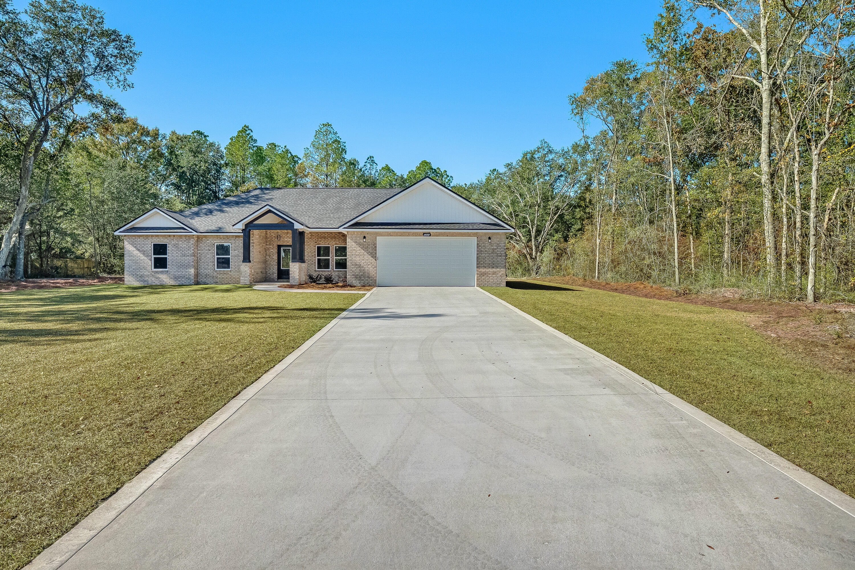 5840 Phillip Road Crestview, FL 32539 - Photo 4 of 59 a front view of a house with a yard
