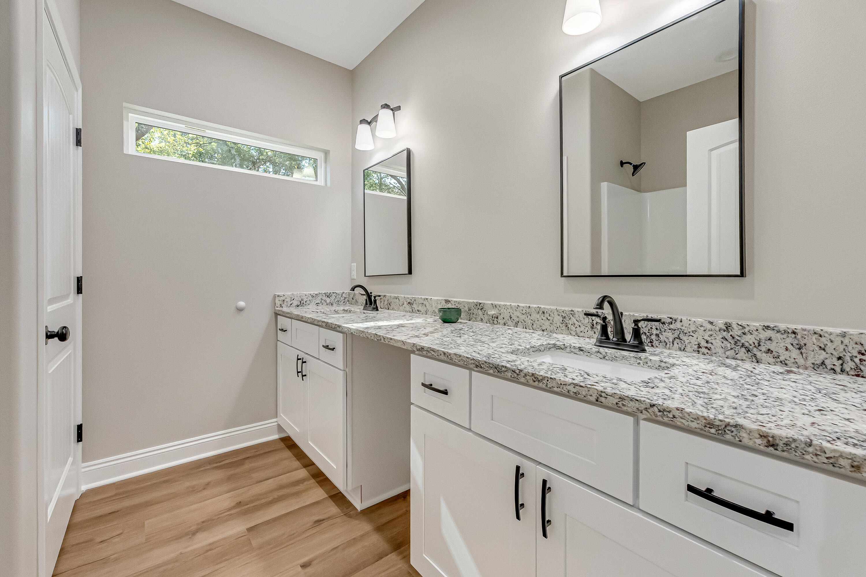 5840 Phillip Road Crestview, FL 32539 - Photo 42 of 59 a bathroom with a granite countertop sink and a mirror