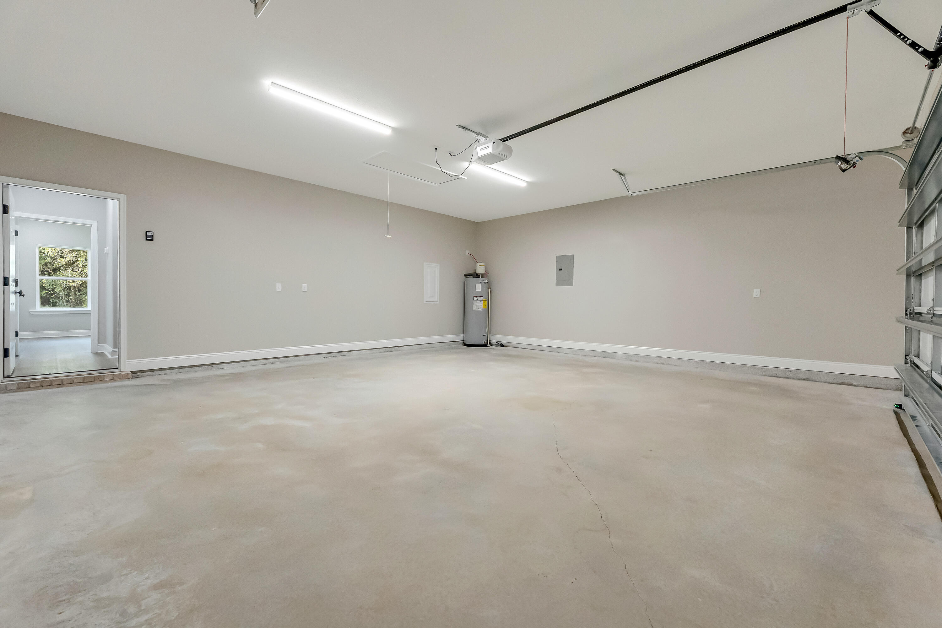 5840 Phillip Road Crestview, FL 32539 - Photo 51 of 59 an empty room with ceiling fan and windows