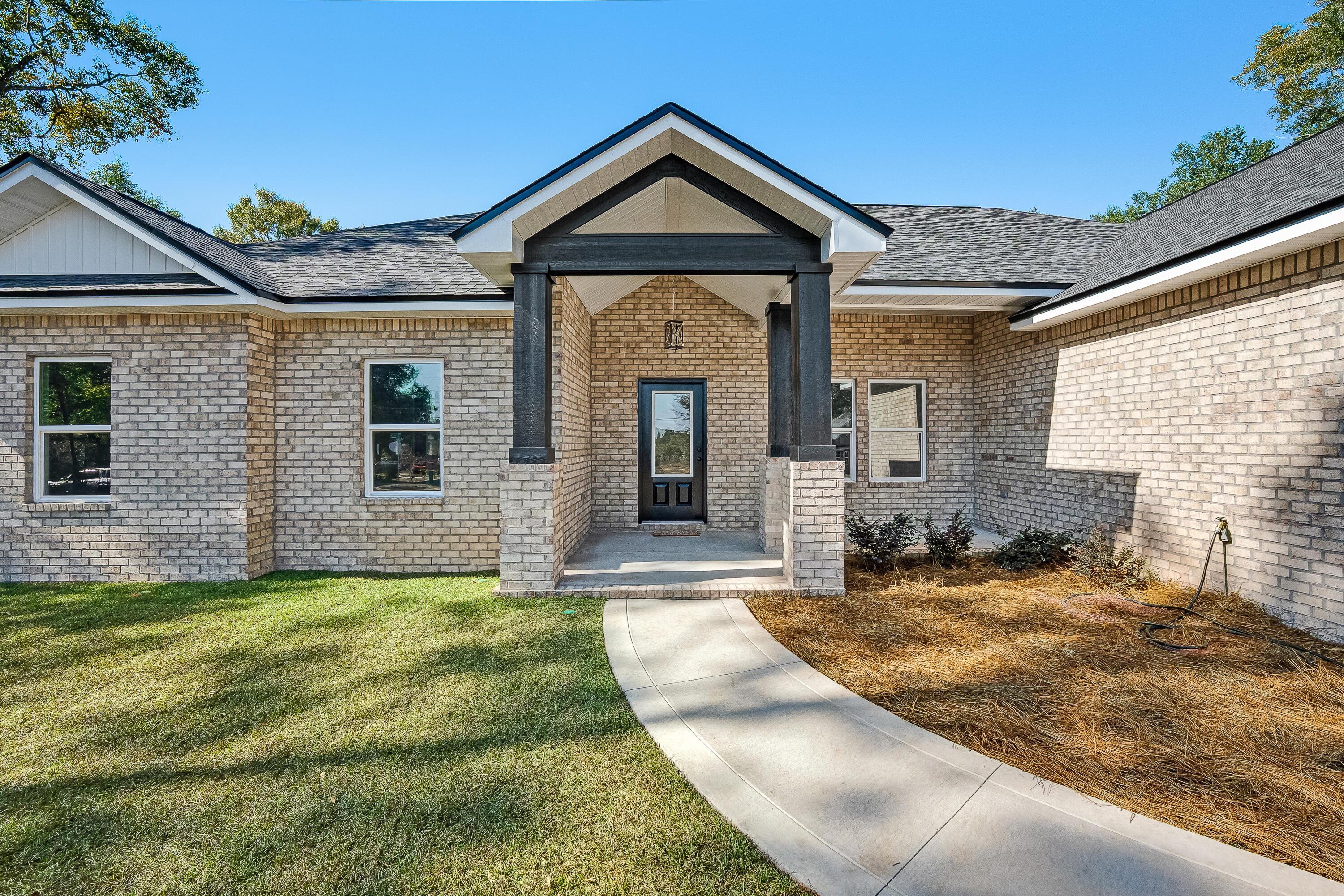 5840 Phillip Road Crestview, FL 32539 - Photo 6 of 59 a front view of a house with a yard