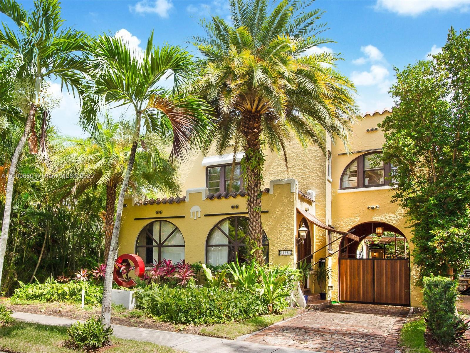 168 Northeast 44th Street Miami, FL 33137 - Photo 1 of 19 a front view of a house with a garden