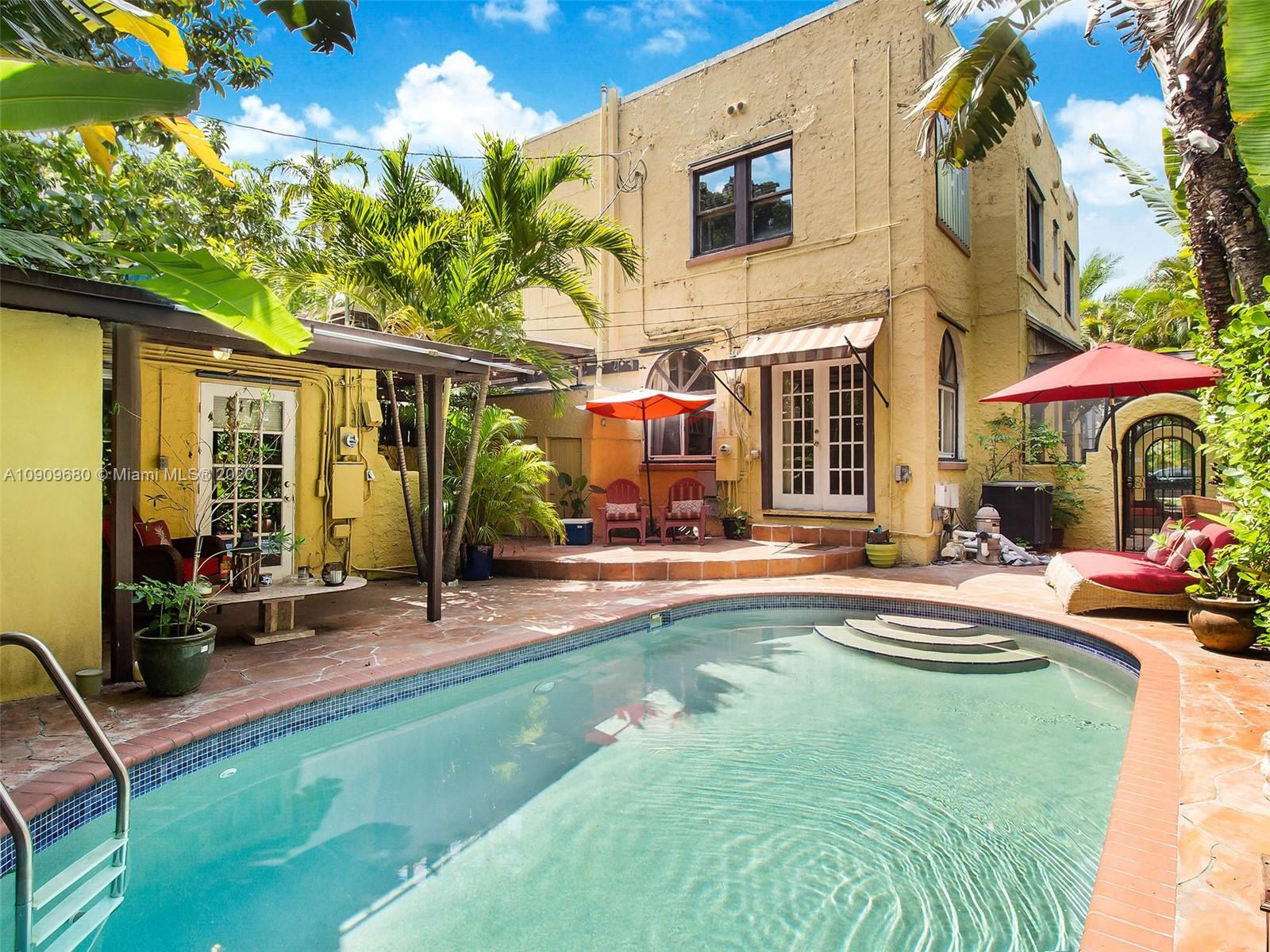 168 Northeast 44th Street Miami, FL 33137 - Photo 16 of 19 a view of a house with swimming pool and sitting area