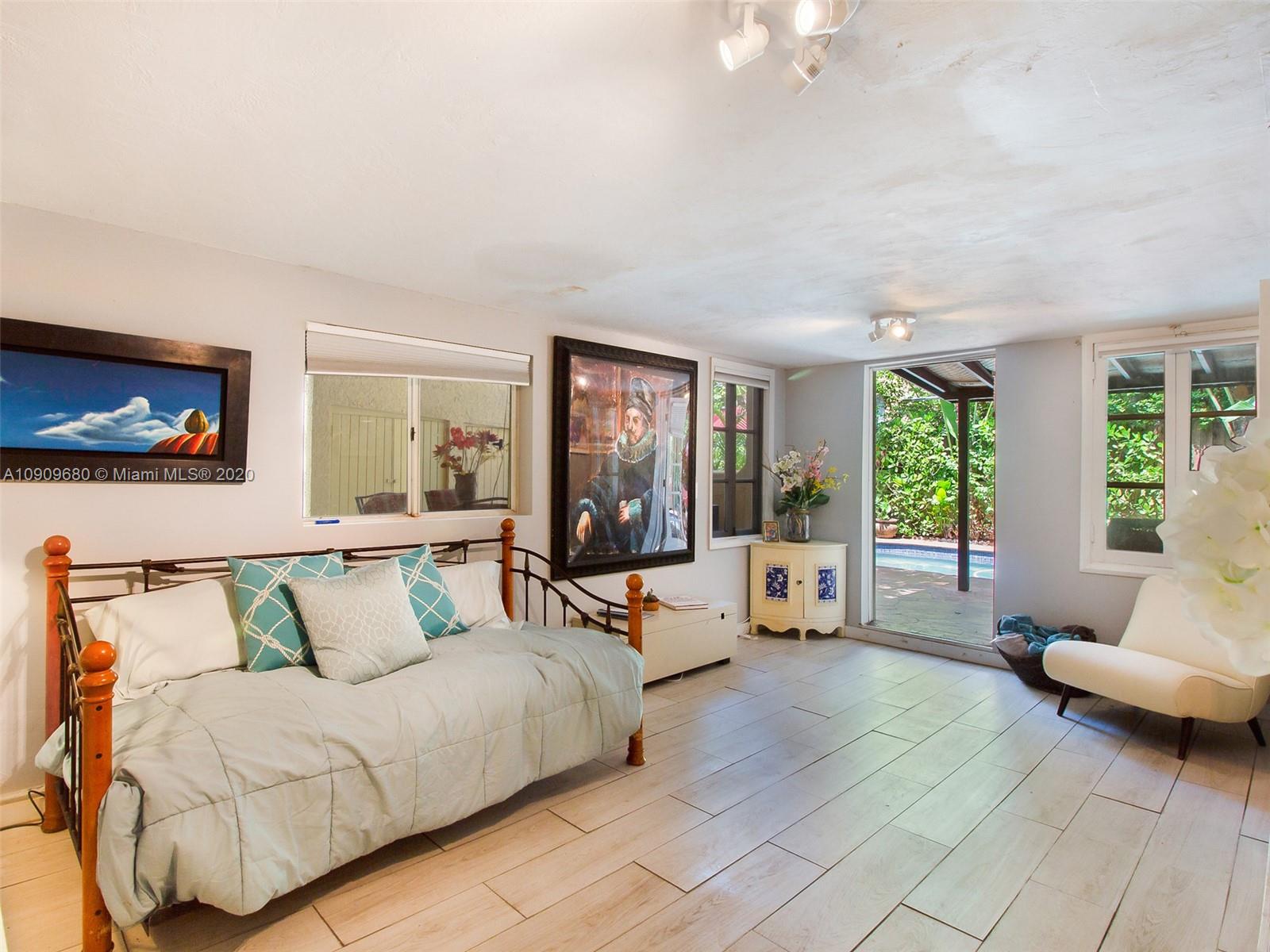168 Northeast 44th Street Miami, FL 33137 - Photo 18 of 19 a living room with furniture and large windows