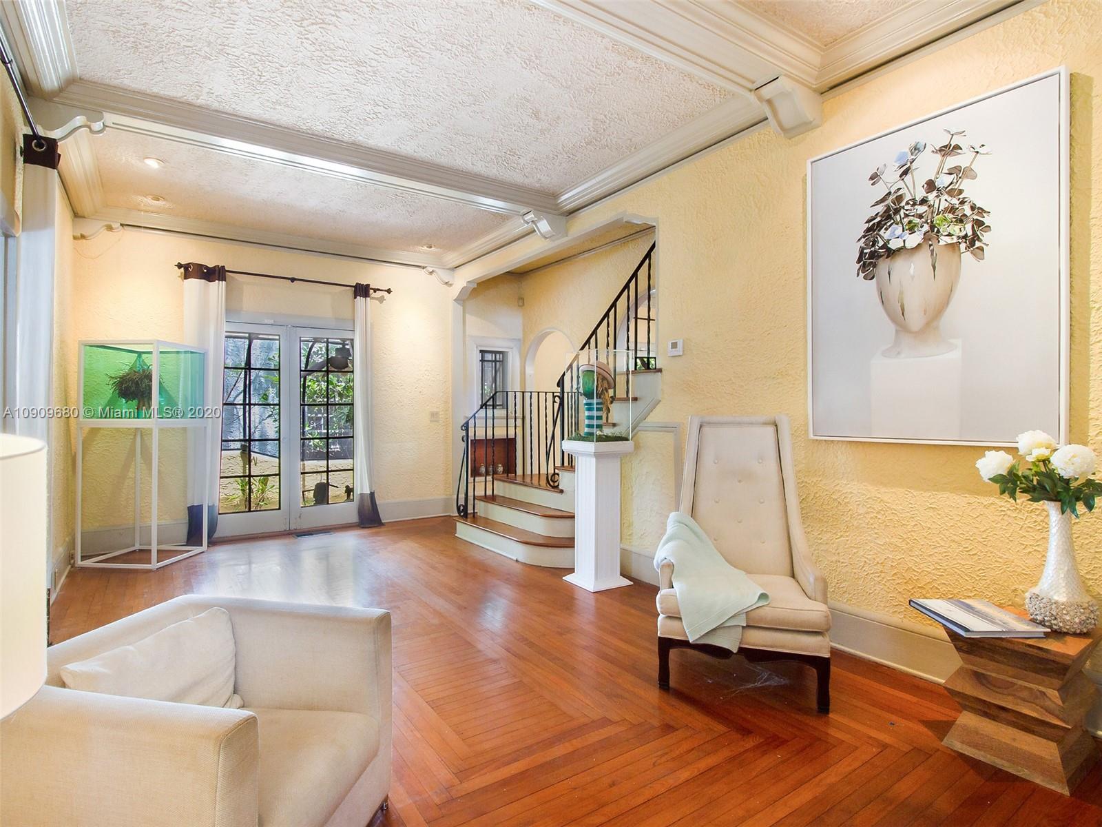 168 Northeast 44th Street Miami, FL 33137 - Photo 4 of 19 a view of a livingroom with furniture and floor to ceiling window