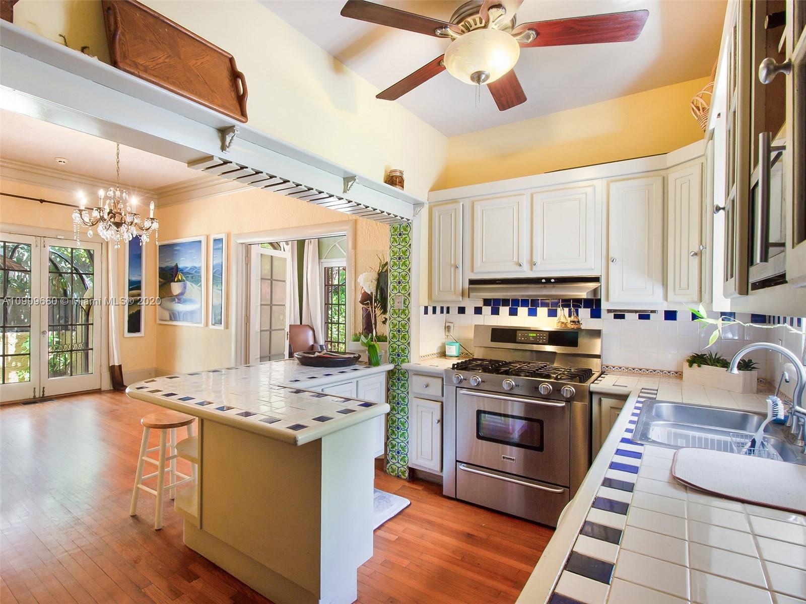 168 Northeast 44th Street Miami, FL 33137 - Photo 7 of 19 a kitchen with stainless steel appliances granite countertop a stove and a sink