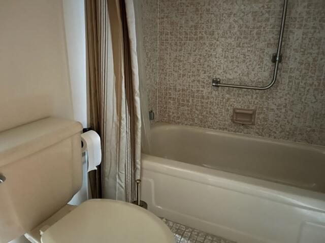 3850 Washington Street, Unit 405 Hollywood, FL 33021 - Photo 11 of 14 a bathroom with a shower and a toilet