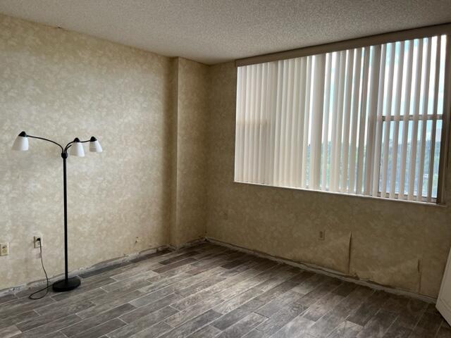 3850 Washington Street, Unit 405 Hollywood, FL 33021 - Photo 12 of 14 a view of a room with wooden floor and windows