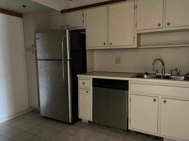 3850 Washington Street, Unit 405 Hollywood, FL 33021 - Photo 8 of 14 a kitchen with stainless steel appliances a refrigerator and cabinets
