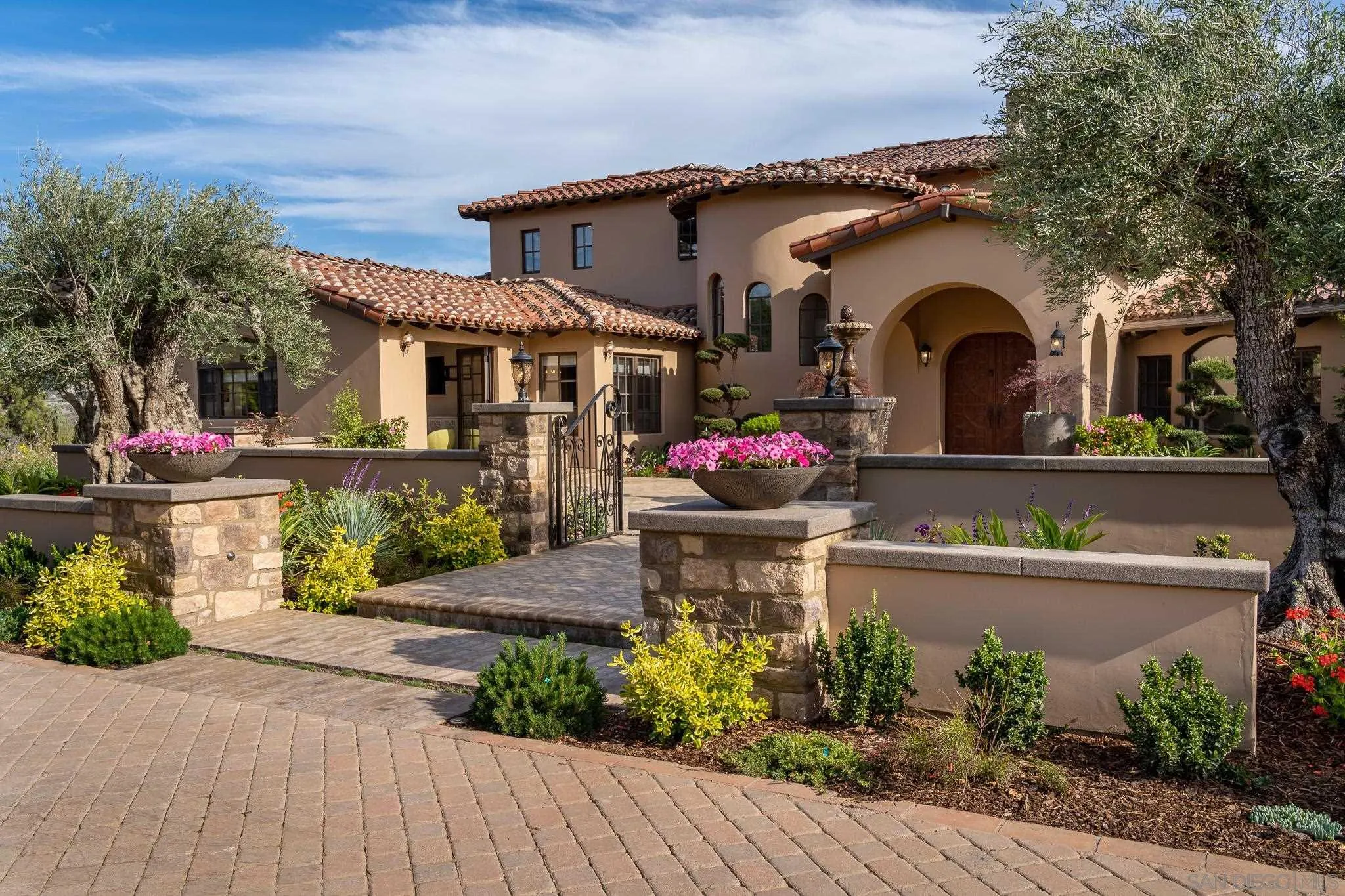 16738 Zumaque Street Rancho Santa Fe, CA 92067 - Photo 11 of 61 a front view of a house with a yard