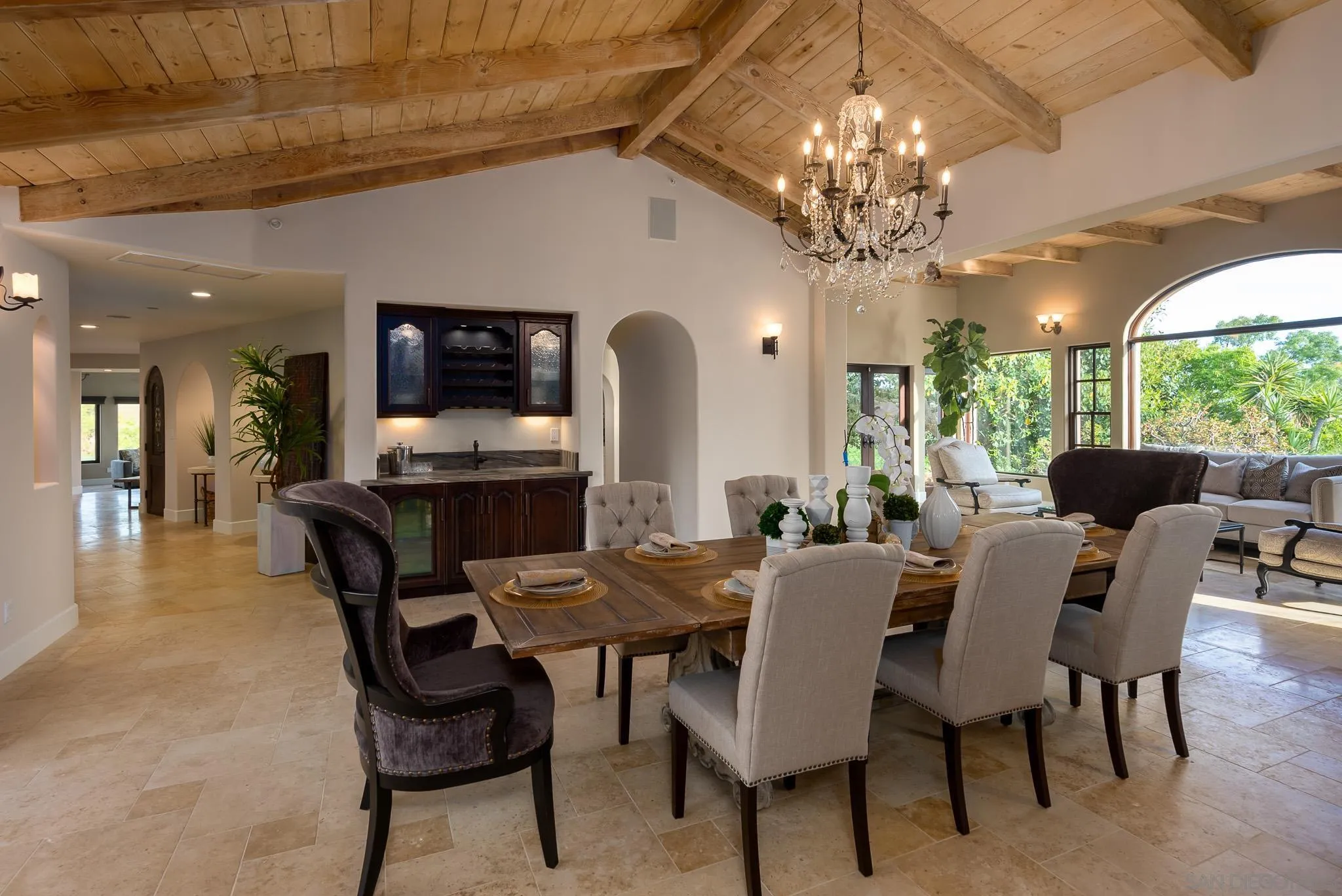 16738 Zumaque Street Rancho Santa Fe, CA 92067 - Photo 16 of 61 a view of a dining room with furniture a chandelier and large windows